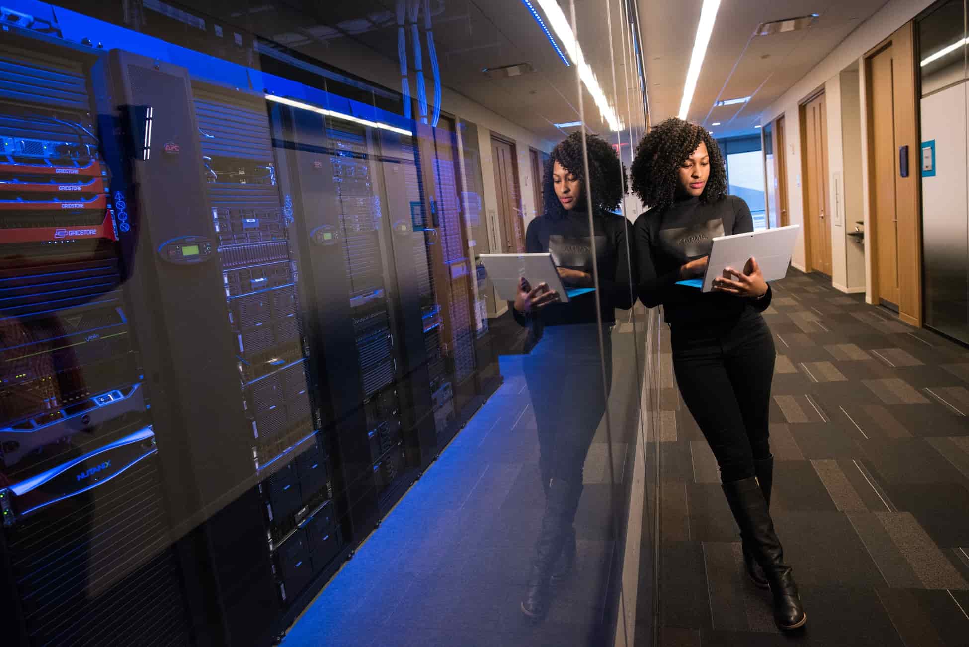 Girl working with computer on the server room